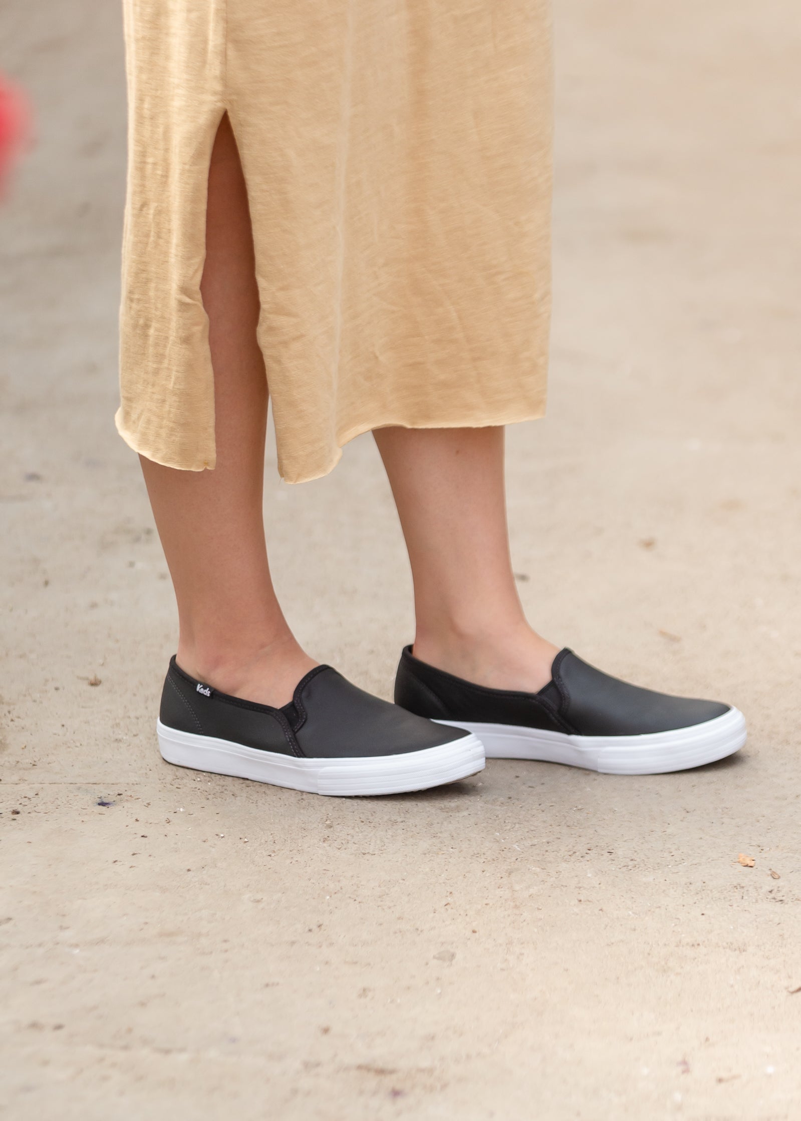 Keds black leather slip on sale on